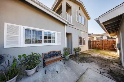 a bench sits outside of a house at Welcoming & Spacious 2-Bedroom Guest Suite in Torrance 20 Minutes from LAX in Torrance