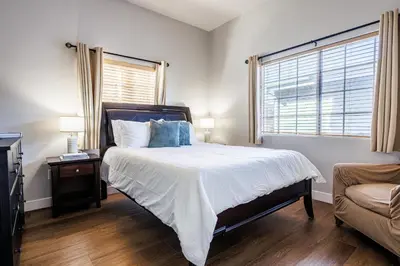 a bedroom with a bed and a window and a couch at Welcoming & Spacious 2-Bedroom Guest Suite in Torrance 20 Minutes from LAX in Torrance