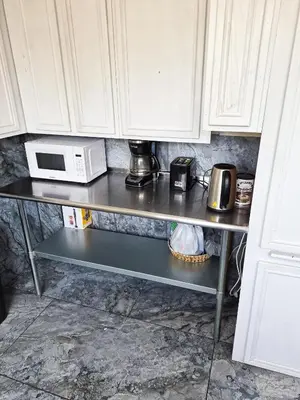 a kitchen counter with a microwave oven on a shelf at Soul in Los Angeles close to Downtown in Los Angeles