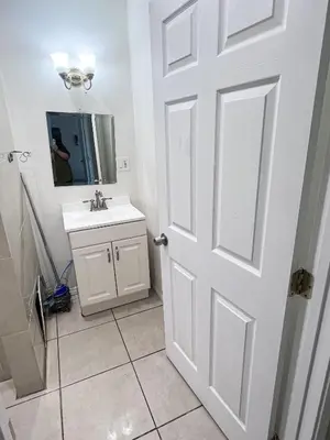 a bathroom with a white door and a sink at Soul in Los Angeles close to Downtown in Los Angeles