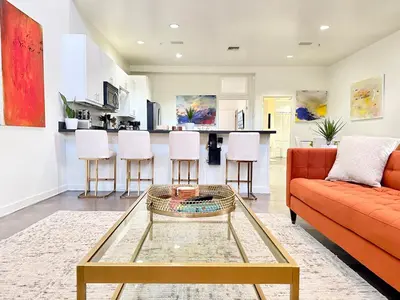a living room with a couch and a table at The Gallery Spacious 2BD 2BA with Two King Beds in Los Angeles