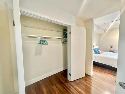 an open closet in a bedroom with a bed at Spacious 2 BD with 2 King Beds Walk to Pier & Beach in Los Angeles