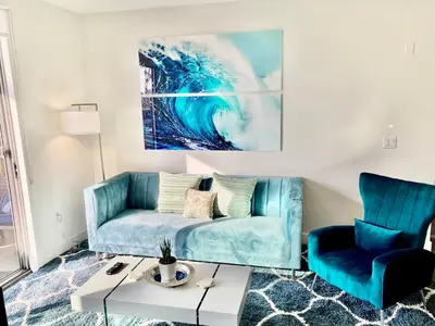 a living room with a couch and a table at 2 KING BEDS Walk PIER BEACH and 3rd St PROMENADE in Los Angeles