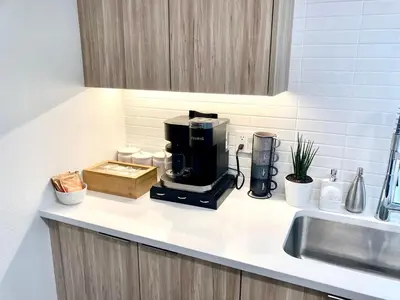a coffeemaker sitting on a kitchen counter next to a sink at 2 KING BEDS Walk PIER BEACH and 3rd St PROMENADE in Los Angeles