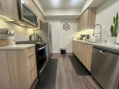 a kitchen with a sink and a stove top oven at 2 KING BED SUITE WALK to BEACH,PIER, PROMENADE in Los Angeles