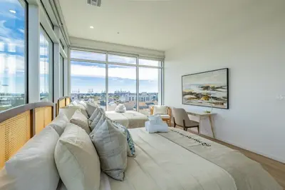 a large bed in a room with a large window at Marbella Lane - Sleek Corner Ocean View in Long Beach