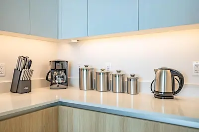 a kitchen counter with various appliances on it at Marbella Lane - Sleek Corner Ocean View in Long Beach