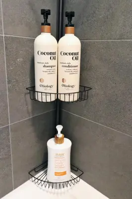 three bottles of coconut oil on a shelf in a bathroom at 2 KING BED LUXURY WALK to BEACH, PIER & PROMENADE in Los Angeles