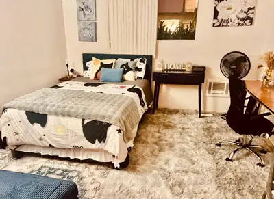 a bedroom with a bed and a desk at Cozy Beach Haven in Los Angeles