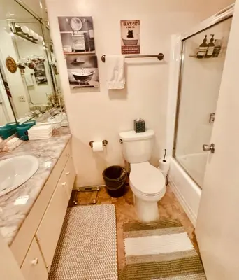 a bathroom with a toilet and a sink at Cozy Beach Haven in Los Angeles