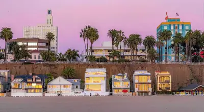a group of houses on the beach with palm trees at Cozy Beach Haven in Los Angeles