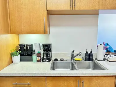 a kitchen counter with a sink and a coffee maker at Bright 2 Bed 2 Bath with Views Walk to the Beach DTSM in Los Angeles