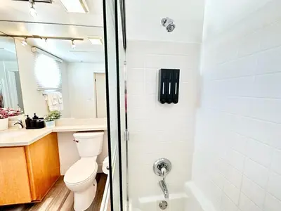 a bathroom with a toilet and a shower at Bright 2 Bed 2 Bath with Views Walk to the Beach DTSM in Los Angeles