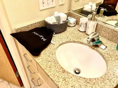 a bathroom counter with a sink and a mirror at Fully Equipped DTSM Studio, Blocks to Ocean & Pier in Los Angeles