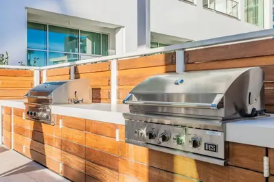 a kitchen with two stoves and a sink at Marbella Lane - Panoramic Splendid Ocean Views in Long Beach
