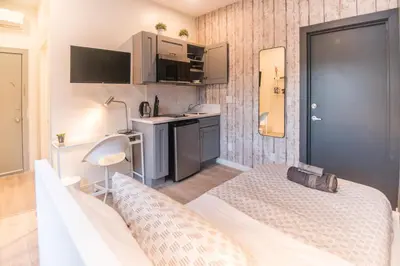 a small room with a bed and a kitchen at Cozy Private Studio, Private Entry in USC DPS Zone - DQA6 in Los Angeles