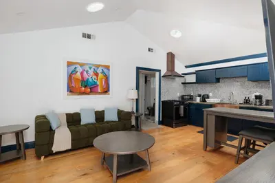 a living room with a couch and a kitchen at Cozy Private 1BR Near LAX & SoFi, Pet-Friendly in Los Angeles