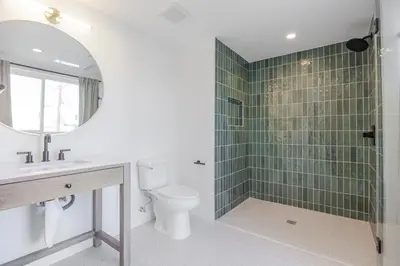 a bathroom with a toilet and a sink and a shower at Blueground East Hollywood rooftop nr Griffith Park LAX-1335 in Los Angeles