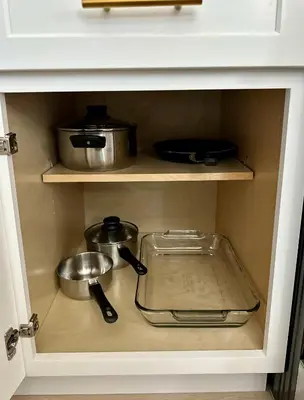 a cabinet with some pots and pans in it at The Mills Retreat in Whittier Near Disney in Whittier