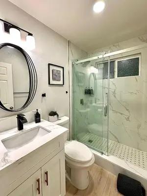 a bathroom with a shower and a toilet and a sink at The Mills Retreat in Whittier Near Disney in Whittier