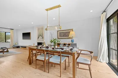 a dining room with a table and chairs at New Listing Venice Villa by Colby & Conrad in Los Angeles