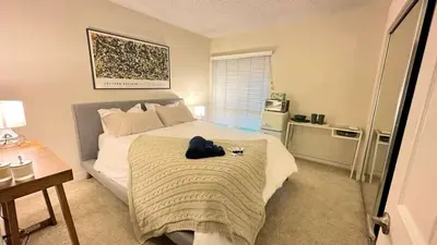 a bedroom with a bed with a hat on it at Cozy stay by Anatolian in Los Angeles
