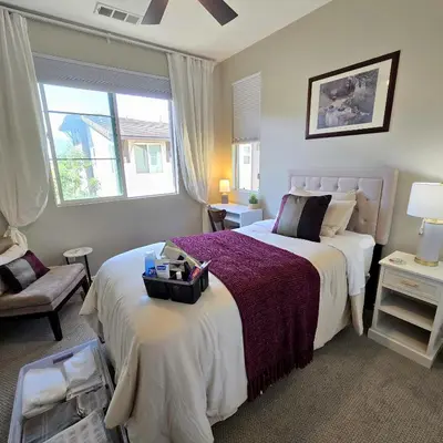 a bedroom with a large bed and a window at The Savi Suite in Corona