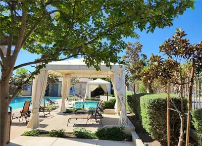 a gazebo with a pool in a yard at The Savi Suite in Corona