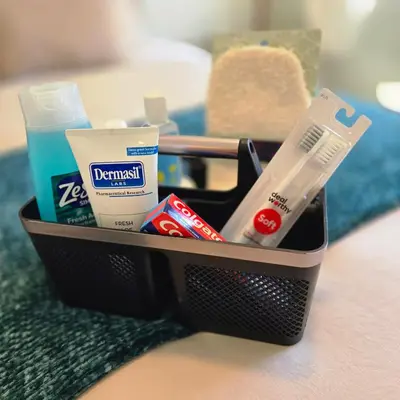 a basket full of bathroom items on a table at The Savi Suite in Corona