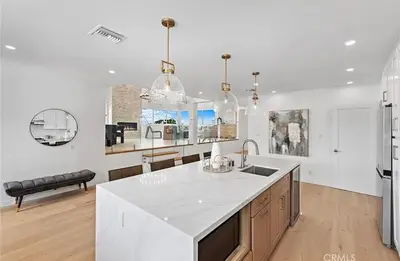 a kitchen with a white counter top and a sink at Ocean View Luxury 5BR Modern Coastal Home in Rancho Palos Verdes