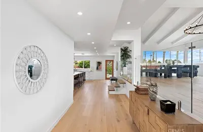 a large living room with white walls and wood floors at Ocean View Luxury 5BR Modern Coastal Home in Rancho Palos Verdes