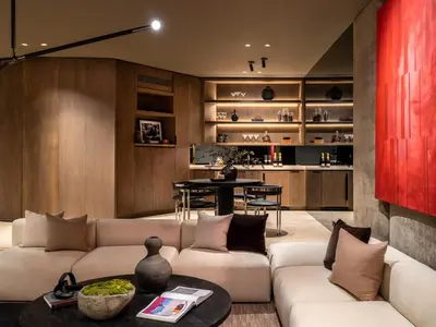 a living room with two couches and a table at Stradella Mansion in Los Angeles