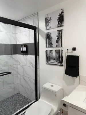 a bathroom with a shower and a white toilet at Comfortable & Quaint Room in a Shared Space in Van Nuys