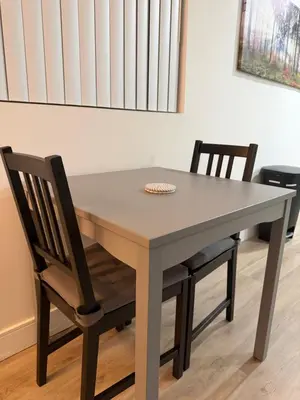 a dining room table with two chairs and a table at Comfortable & Quaint Room in a Shared Space in Van Nuys