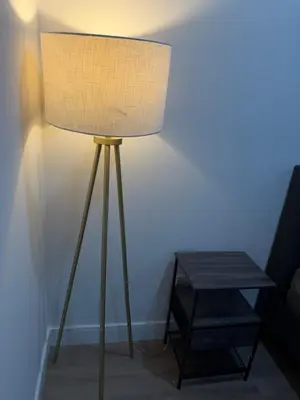 a lamp sitting next to a table in a room at Comfortable & Quaint Room in a Shared Space in Van Nuys