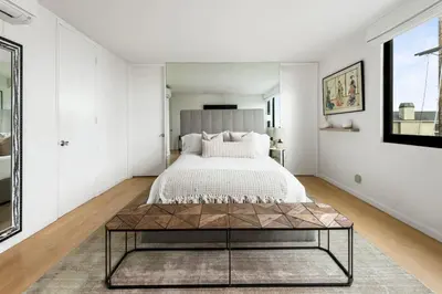 a bedroom with a bed and a coffee table at Northstar Premium Ocean Penthouse in Los Angeles