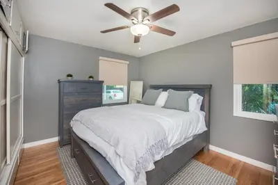 a bedroom with a bed and a ceiling fan at Welcome to your home at the Orange Circle in Orange
