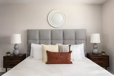 a bedroom with a large white bed with a large headboard at Spacious Home Central Area Airport Free Parking in Burbank