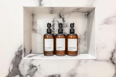 two bottles of essential oils sitting on a shelf at Charming LA Gem by SOFI, Games & Close to it ALL in Los Angeles