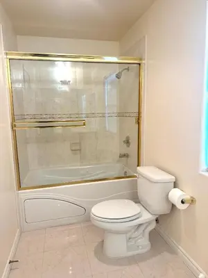 a bathroom with a toilet and a shower and a tub at Spacious 3BR 3BA Home 3 Car Garage Garden Near DTLA Pasadena Hollywood in Alhambra