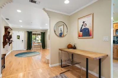 a home office with a table and a mirror at New Listing Burbank Retreat by Colby & Conrad in Burbank