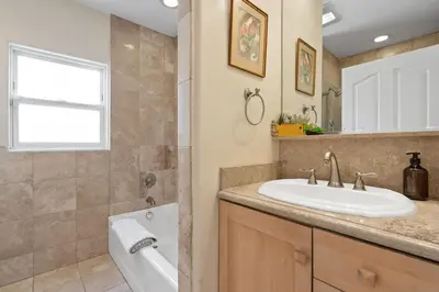 a bathroom with a sink and a bath tub at New Listing Burbank Retreat by Colby & Conrad in Burbank