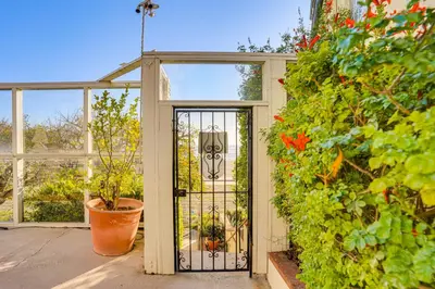 an open door in a greenhouse with plants at Beachfront Living in Long Beach 2,500 Sq Ft Condo in Long Beach