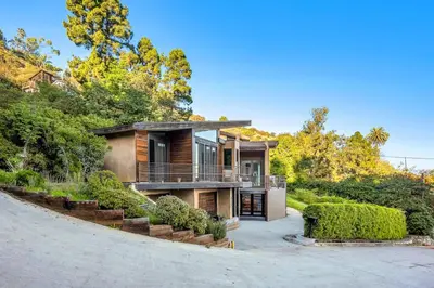 a house with a staircase leading up to it at Ridpath Retreat Guest House in Los Angeles