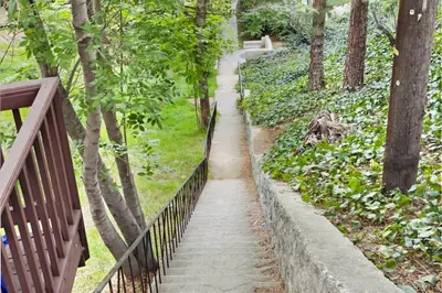 a stairway in a park with a fence at Secret Stairs Family in Los Angeles