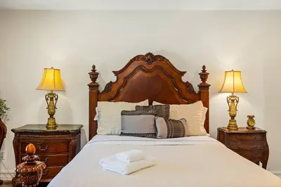 a bedroom with a large bed with two night stands at Marbella Lane - Tranquil Country Escape Getaway in Placentia