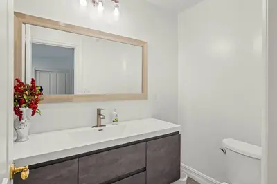 a bathroom with a sink and a mirror at Marbella Lane - Tranquil Country Escape Getaway in Placentia