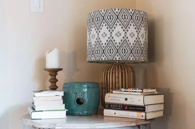 a table with a lamp and books on it at Lush Venice Beach Oasis Home -just steps to beach in Los Angeles