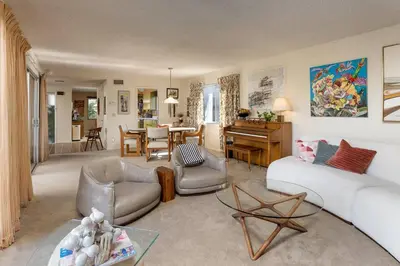a living room with a couch and a table at NEW Vintage Canyon Retreat in Mount Washington in Los Angeles