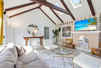 a living room with a white couch and a fireplace at Bel Air Very Private and Comfy Home with Jacuzzi in Los Angeles